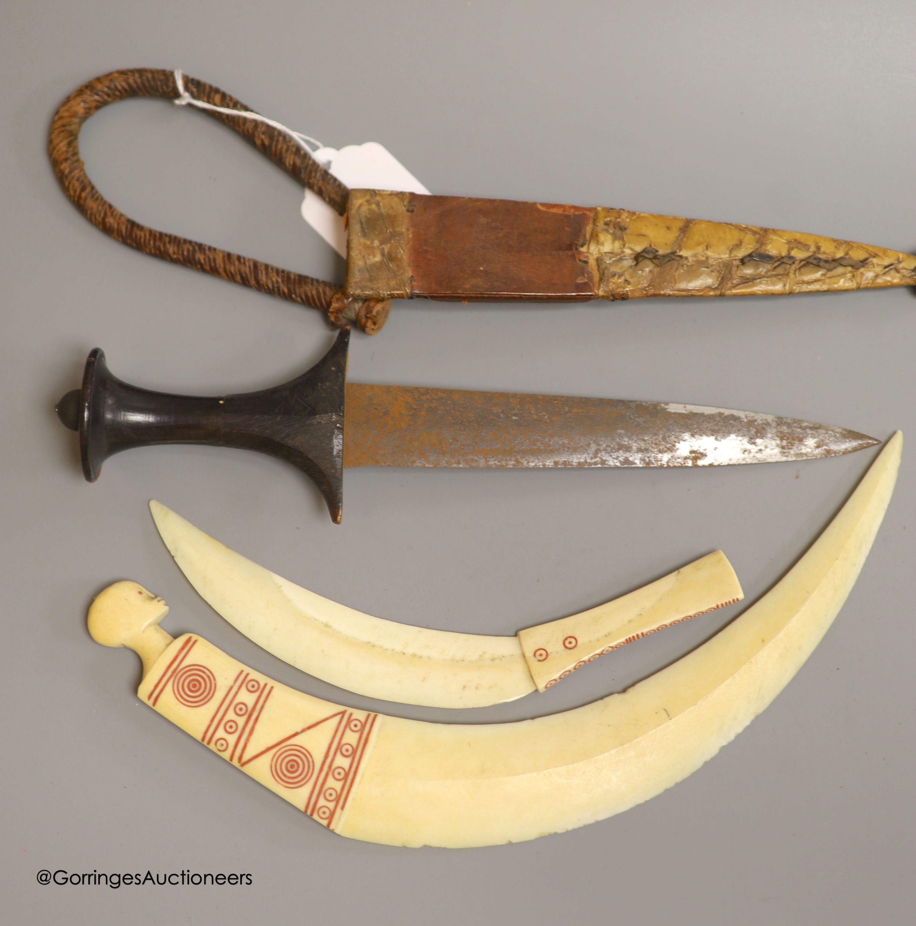 Four shot balls, two daggers, various weights, a pair of binoculars and Chinese hardstone cameo beads etc
